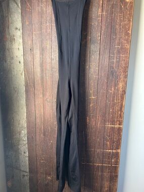 FP Movement by Free People Black Slim Jumpsuit boot cut bottom with slits.